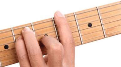 E shape barre chord form on guitar